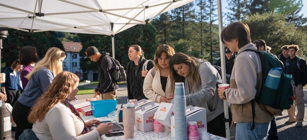Students line up at Wake Up Wednesday to grab donuts and coffee 