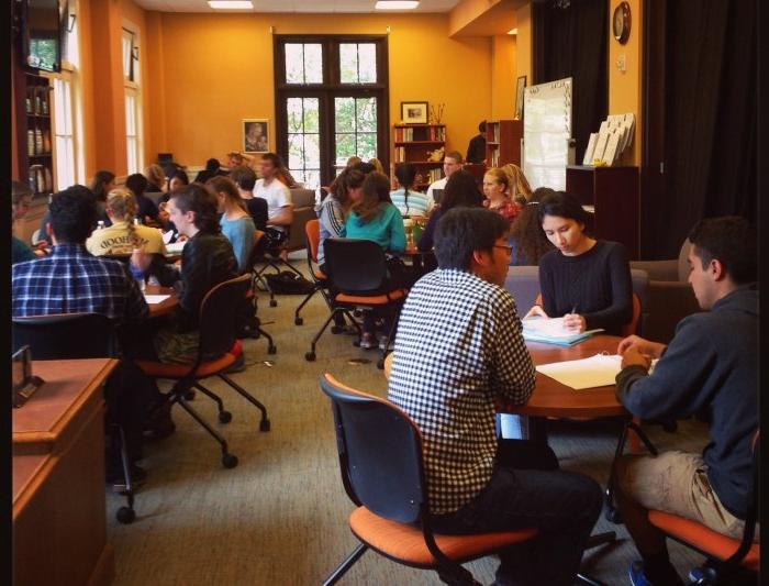 A view of the Writing Center full of writers, Writing Advisers, and Writing Circle Facilitators