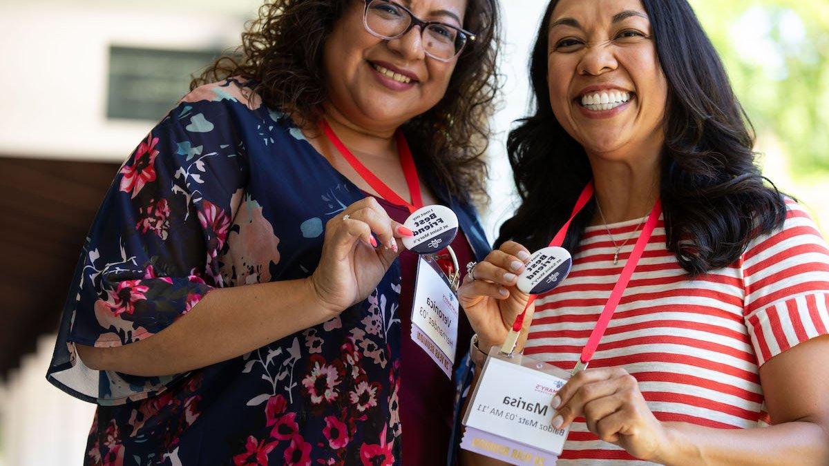 Marisa Soto Baldoz and Veronica Hernandez, class of 2003, show their "best friend" buttons at Reunion 2023